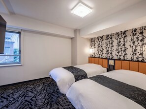 A hotel room with two beds, a window with a view, a patterned wall, and a ceiling light. - APA Hotel Asakusabashi Ekimae (Tokyo)