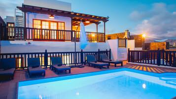 A heated pool, pool loungers