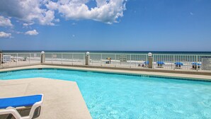 A swimming pool with a view of the beach and ocean. - One Ocean Place 1207 - Fabulous 3-bedroom, 3-bath oceanfront condo (Garden City Beach)