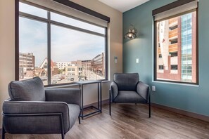 Premium bedding, desk, laptop workspace, iron/ironing board