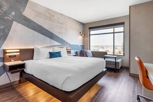 Premium bedding, desk, laptop workspace, iron/ironing board