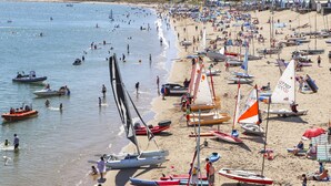 A beach with numerous boats and people. - Harbour View (Pwllheli)