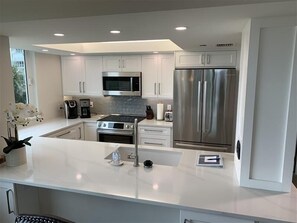 Coffee/tea maker, toaster, dining tables