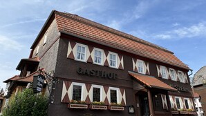 A traditional building with a sign reading "GASTHOF" and "GASTSTERY".