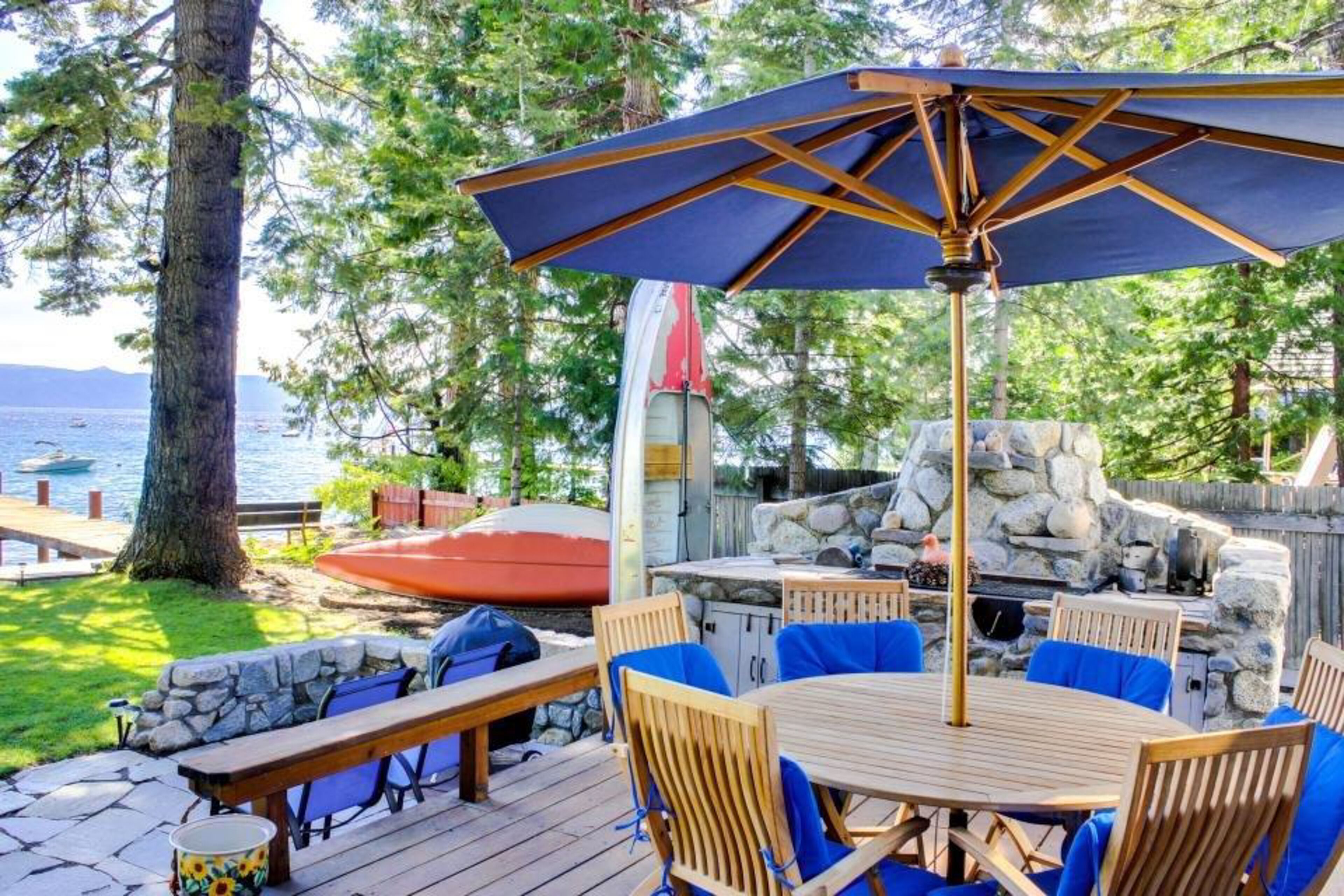 Waterfront home with backyard beach, dock, & hot tub - walk to Homewood slopes