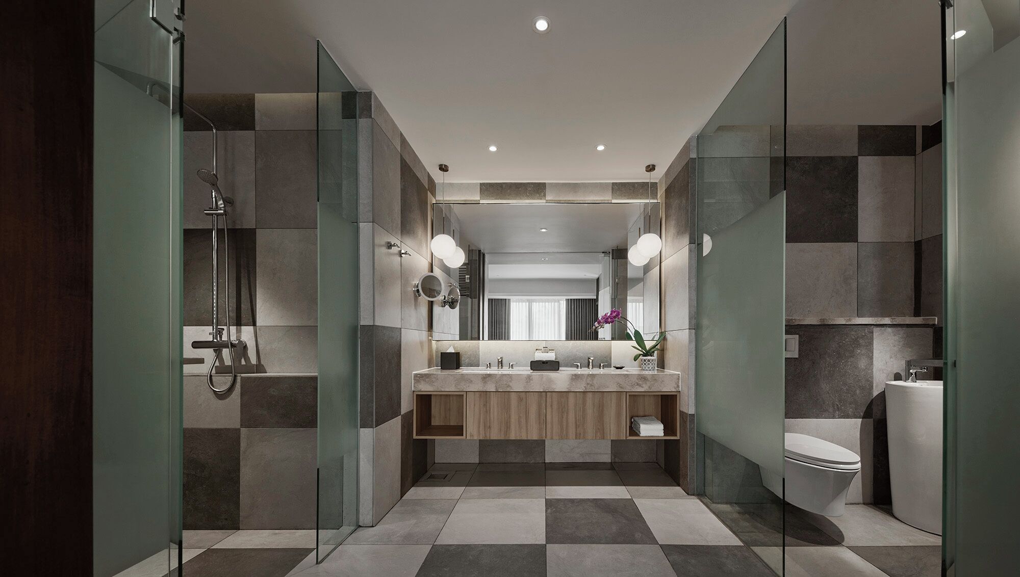 A modern bathroom with a glass-enclosed shower, a vanity with a mirror, and a toilet.