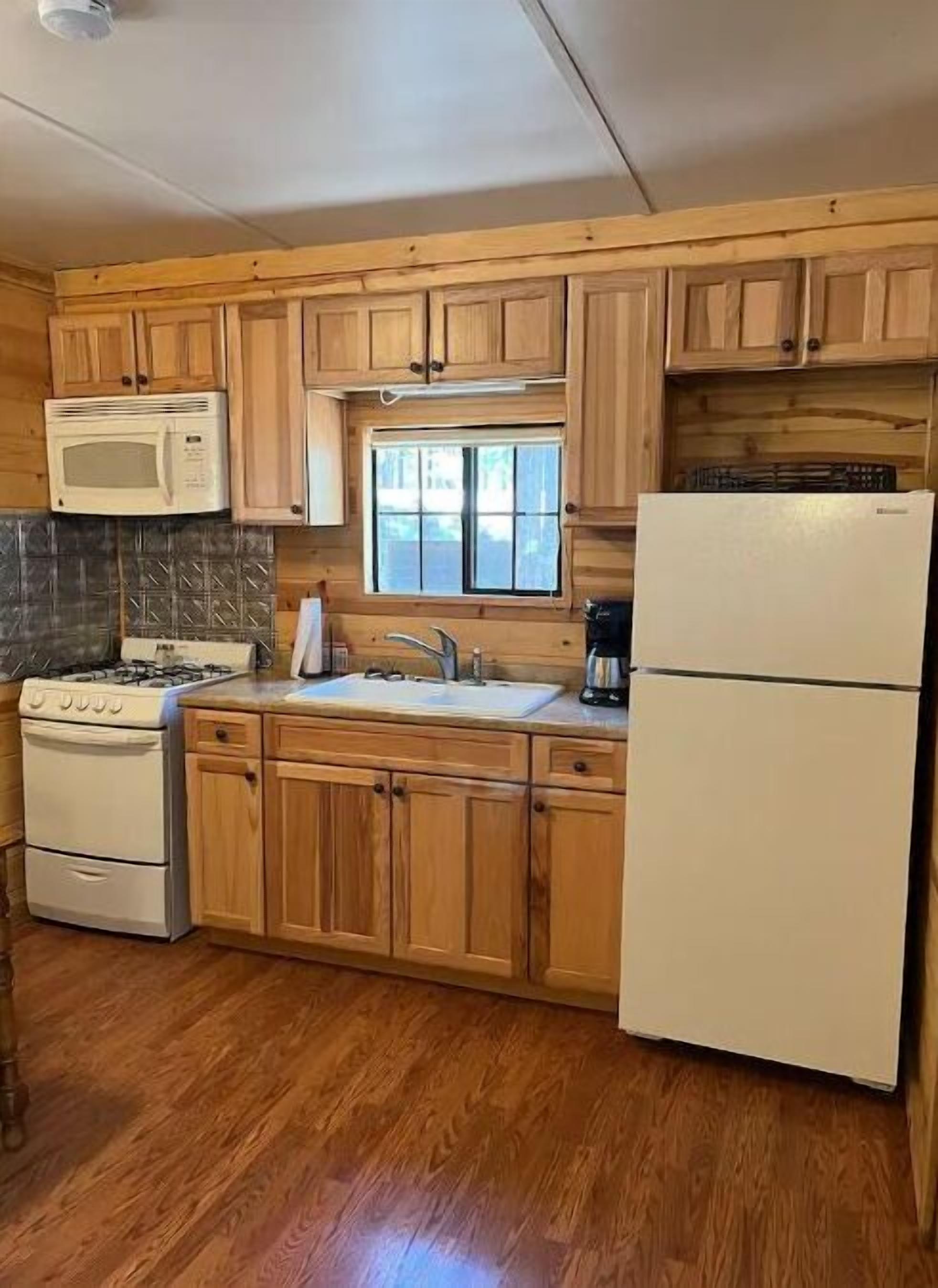 Coffee/tea maker, fridge, microwave, oven