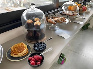 Indulge in a sumptuous breakfast spread featuring an assortment of sweet and savory delights.