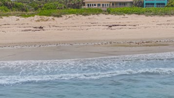 On the beach, sun loungers, beach towels