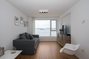 Family Apartment, 2 Bedrooms, Sea View, Oceanfront | Living area | TV