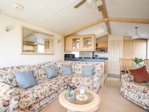 Cottage | Living room | Fireplace - Bryn Hyfryd Caravan (Dulas)