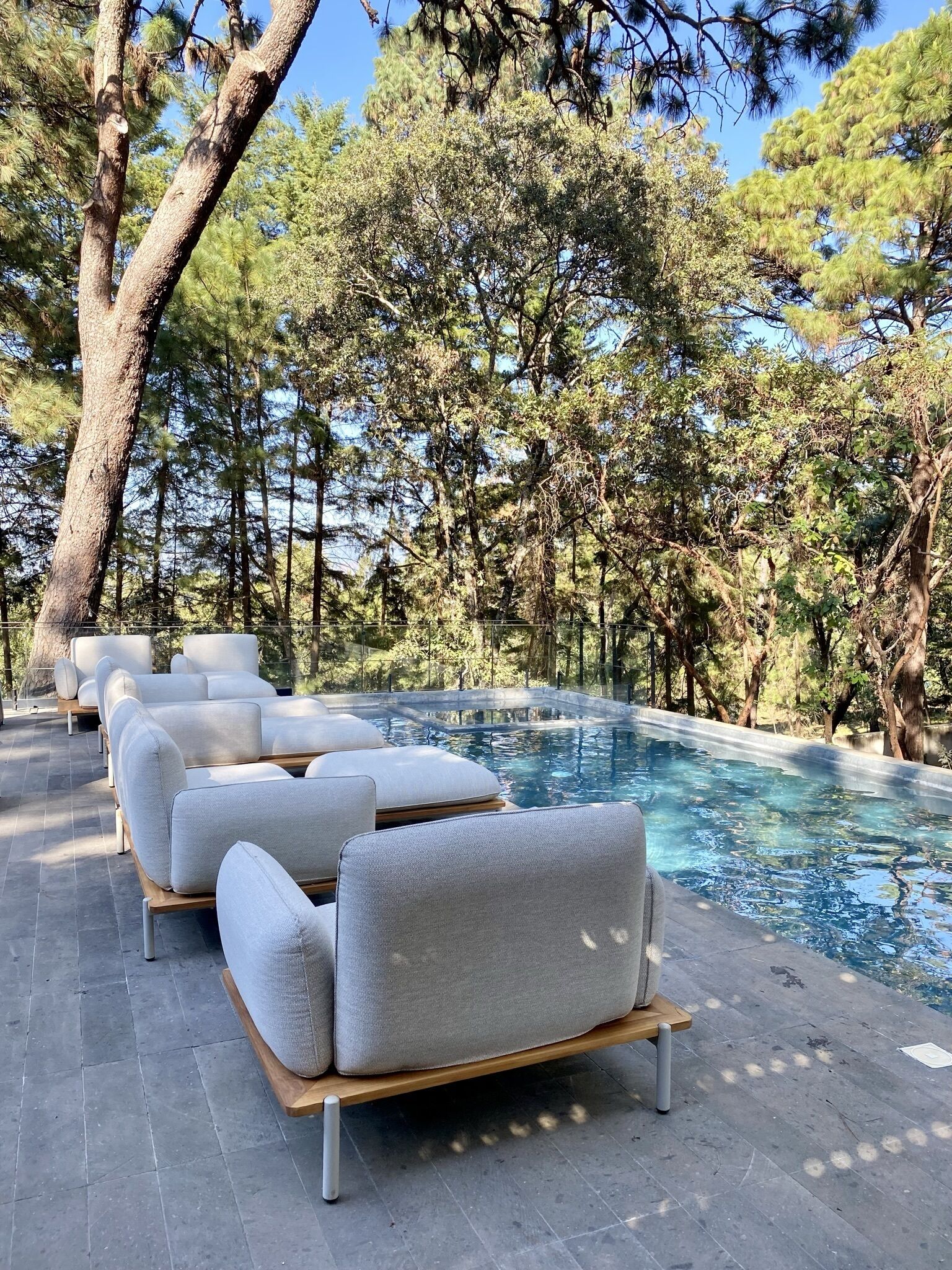 outdoor pool, open 9:00 am to 8:00 pm, pool umbrellas, pool loungers