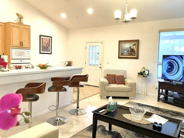 Smart TV, fireplace, books, computer monitors