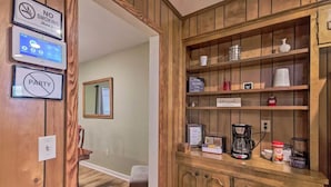 A wooden interior with a coffee station, a 'No Smoking' sign, and a 'Party' sign. - Peaceful Home, Colleges-Hospitals-Shops Close, Corporate Bookings Welcome  (Jackson)