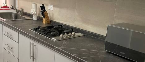 Microwave, stovetop, coffee/tea maker, toaster