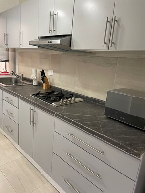 Microwave, stovetop, coffee/tea maker, toaster