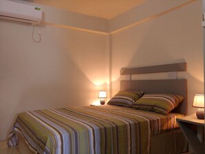2 quartos, cofres nos quartos, ferros/tábuas de passar roupa, Wi-Fi