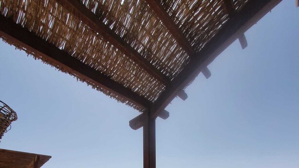 A resort balcony with a view of a pool and beach. - 2 BR flat overlooking open lagoon and private pool (Red Sea Governorate)