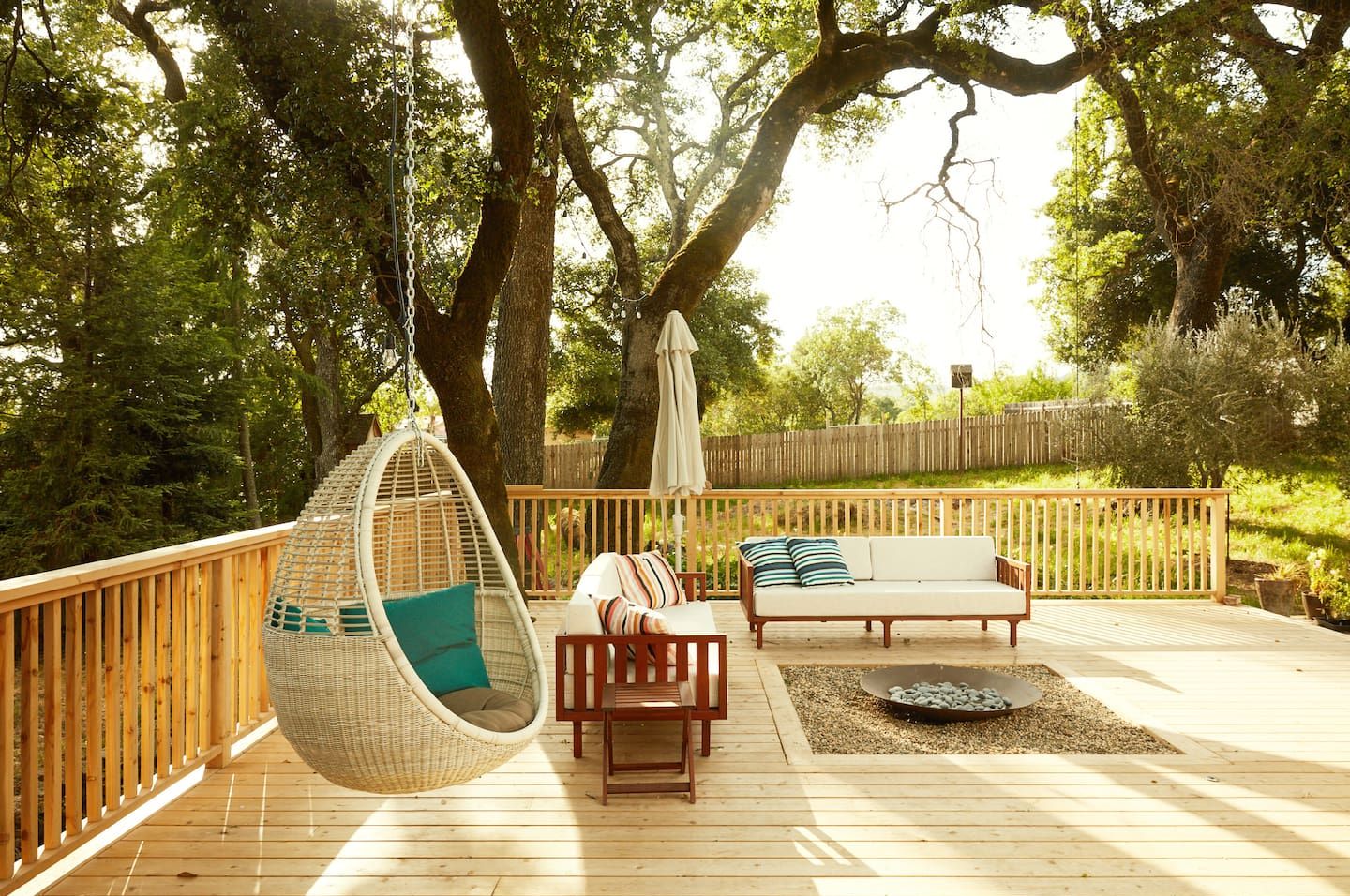 Deck with hanging chair and fire pit 