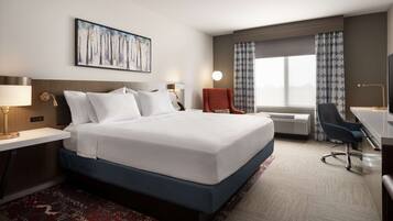 Desk, laptop workspace, iron/ironing board, bed sheets