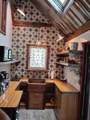 Fridge, microwave, stovetop, coffee/tea maker