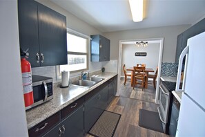 Fridge, microwave, oven, stovetop - Flaming Gorge Getaway - Boat Parking + Fenced Yard + Prime Location! (Manila)