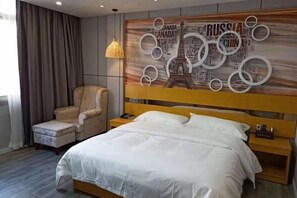 A hotel room with a bed, a chair, a nightstand, and a wall with a circular design. - Tuke Boutique Hotel (Taishan)