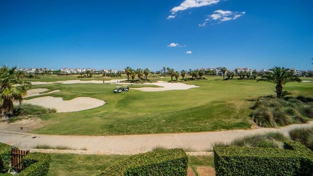 A golf course with sand bunkers, a golf cart, and palm trees. - East facing apartment with golf views - AO311LT (LTGR Roldán)