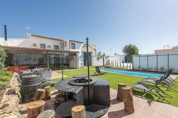 Property building,BBQ facilities,Garden,Pool view,Swimming pool