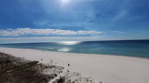 A beach with a clear sky, calm sea, and a sandy shore. - Beachfront 2Br, 2 Bath at Dunes of Panama- Sleeps 8  (3 pools, one heated) (Panama City Beach)