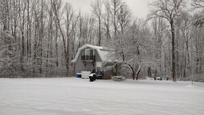 A cabin surrounded by snow-covered trees. - Secluded Cabin Retreat – Peace, Privacy & Nature (Mansfield)