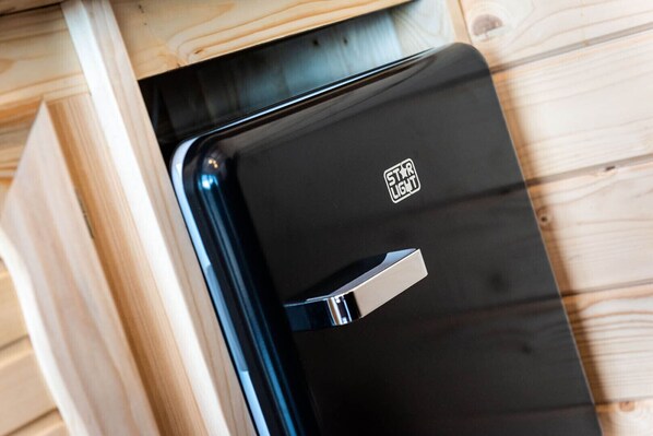 A black suitcase with a metallic handle and a "STARLIGHT" logo.
