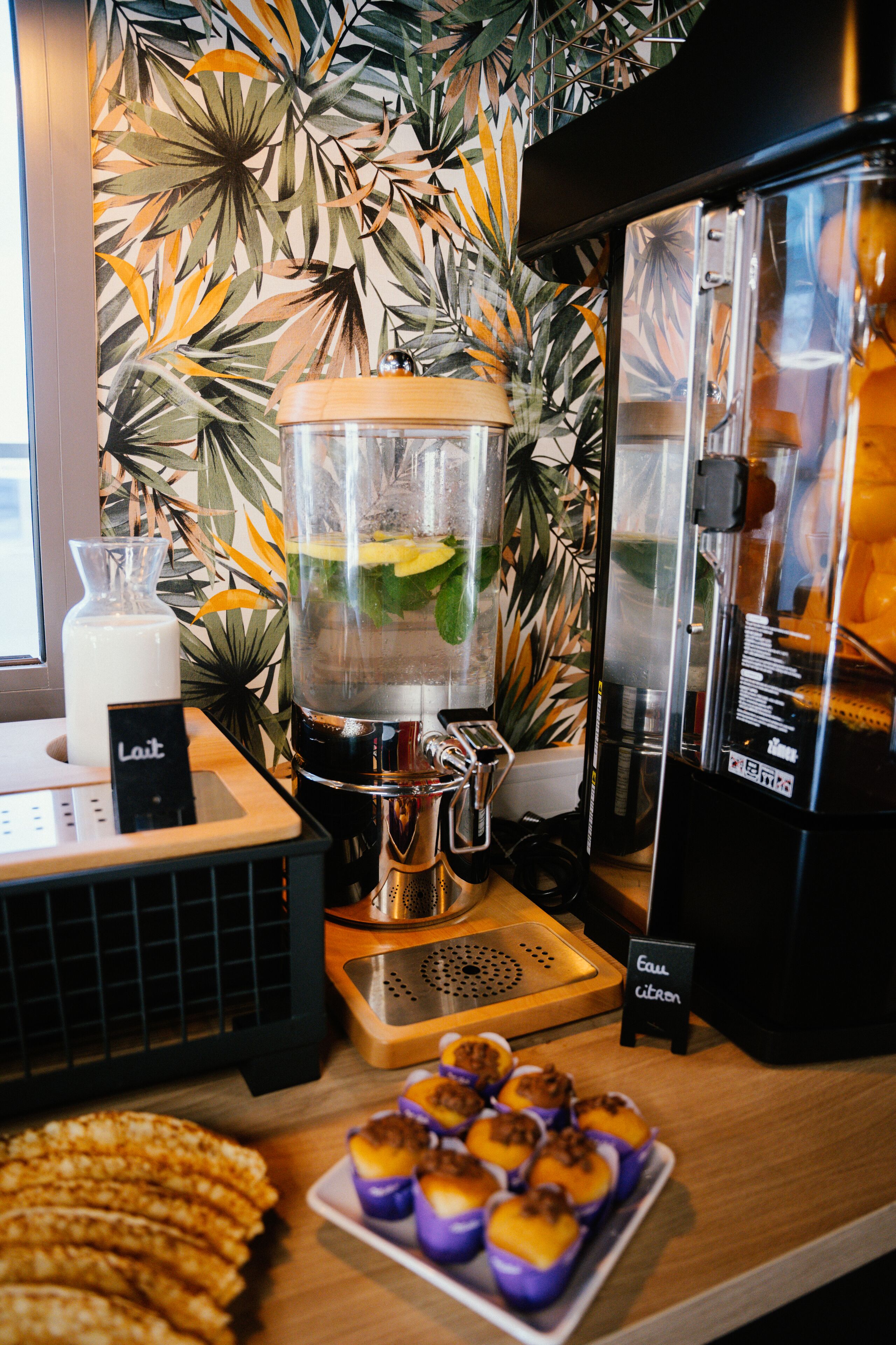 A coffee bar with a blender, a milk pitcher, and a sign that reads "Lait".