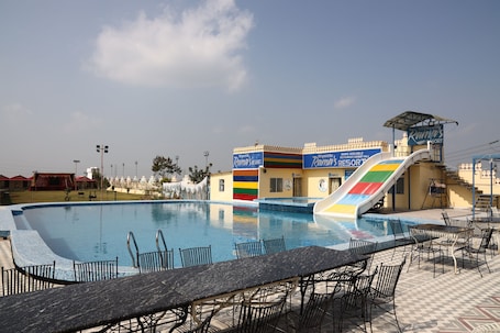 Outdoor pool, open 8:00 AM to 7:00 PM, pool umbrellas, sun loungers