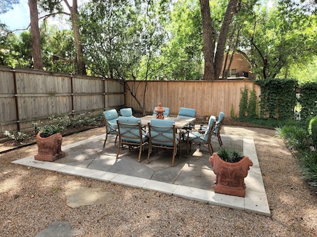 Outdoor dining. Garage apartment central to all activities.
