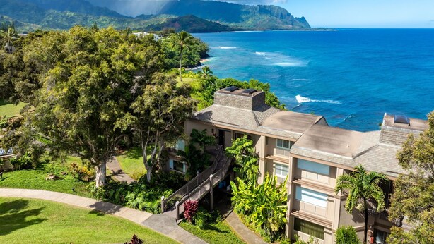 A coastal property with a view of the ocean and mountains. - Pali Ke Kua #222 - Breathtaking Ocean Views! (Princeville)