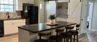 Newly remodeled,  handicap accessible overlooking pool , play area