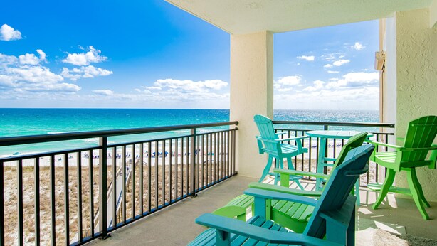 A balcony with a view of the beach and ocean. - A Joyful Breeze | Beachfront, Pool, Grills, Fun! (Navarre Beach)