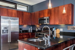 Condo, 1 King Bed, Balcony (Good Vibrations) | Private kitchen | Fridge, microwave, oven, stovetop