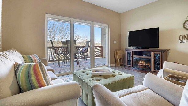 Condo, Multiple Beds, Balcony (Lakefront Sanctuary) | Living area | 42-inch flat-screen TV with digital channels, fireplace - Lakefront Sanctuary - Table Rock Lake Adventures (Branson)