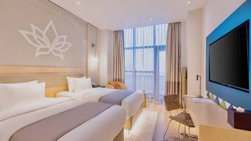 Twin kamer, 2 eenpersoonsbedden | Luxe beddengoed, pillowtop-bedden, een minibar, een kluis op de kamer