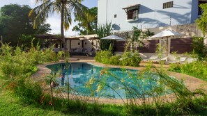 Outdoor pool, open 8:00 AM to 8:00 PM, pool umbrellas, pool loungers