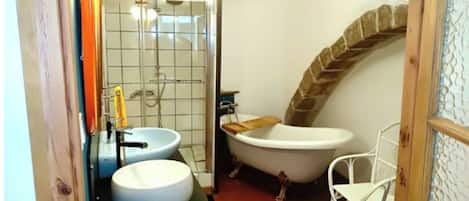 Bathtub, hair dryer, towels, soap