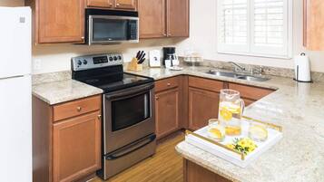 Townhome, Multiple Beds, Patio, Garden View (Rendezvous at Regal Palms) | Private kitchen | Fridge, microwave, oven, stovetop