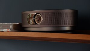 A modern projector on a wooden shelf with books. - Cosy and Stylish (T'bilisi)
