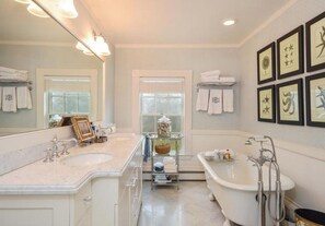 Combined shower/bathtub, hair dryer, towels, toilet paper