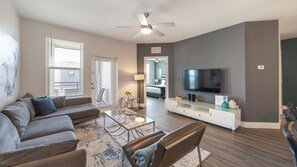 Standard Condo, 2 Bedrooms | Living area | 50-inch TV with digital channels