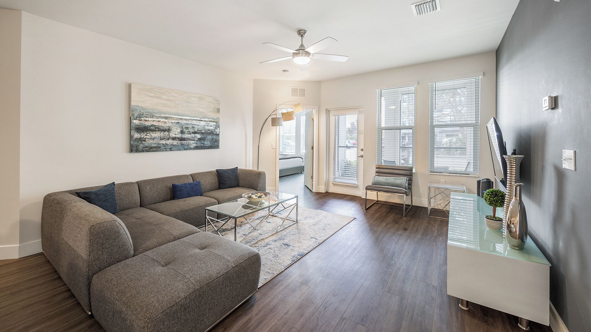 Deluxe Condo, 3 Bedrooms | Living area | 50-inch TV with digital channels