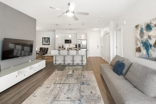 Deluxe Condo, 2 Bedrooms | Living area | 50-inch Smart TV with digital channels