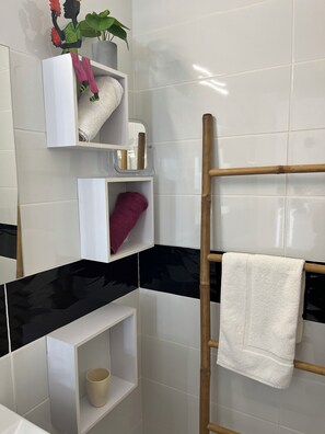 Shower, hair dryer, towels, toilet paper